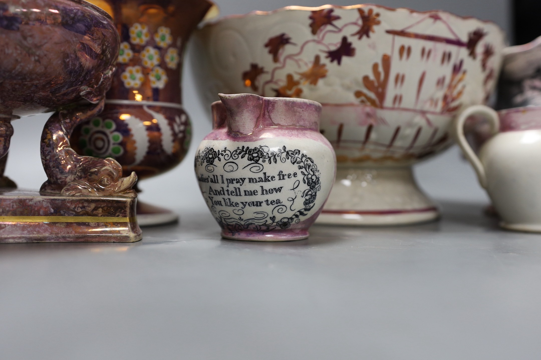 A group of early 19th century pink lustre vases and jugs and a junket bowl